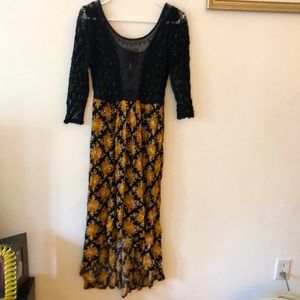 Free People NEVER WORN high low dress Size 8. Black with yellow print.
